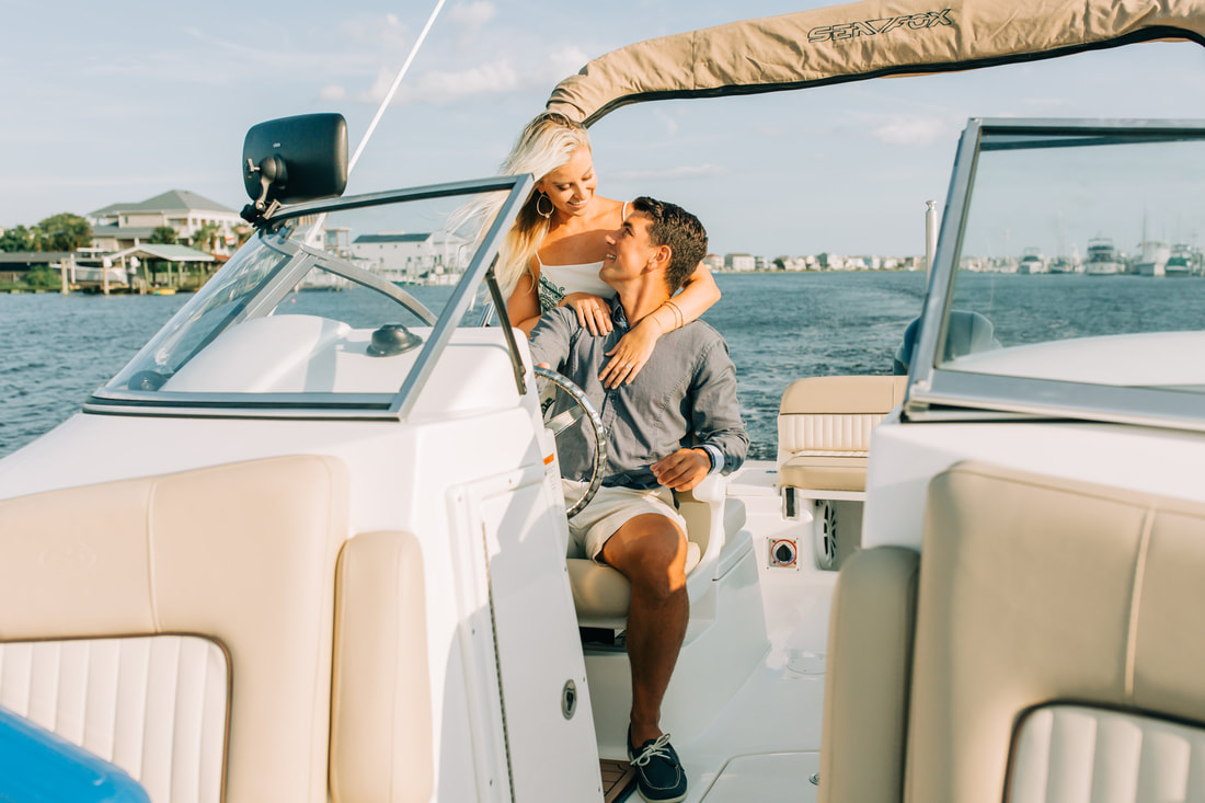 Wilmington wedding photographer takes engagement pictures in Carolina Beach on a boat 