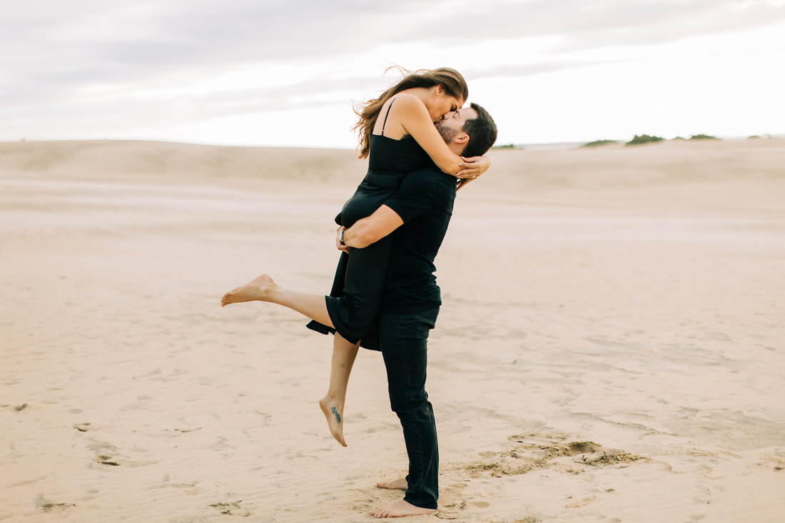 Sand Dunes engagement in all black outfits, jockey's ridge state park 