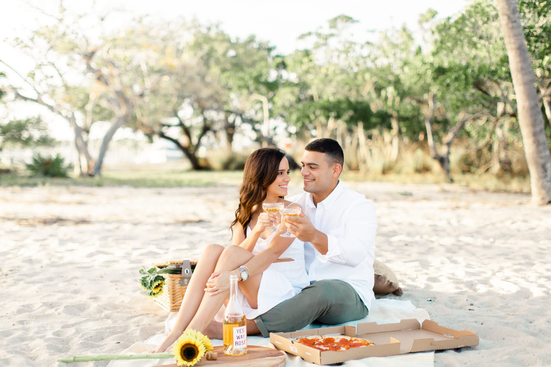 Raleigh wedding photographer Miami pizza picnic beach engagement champagne creative engagement