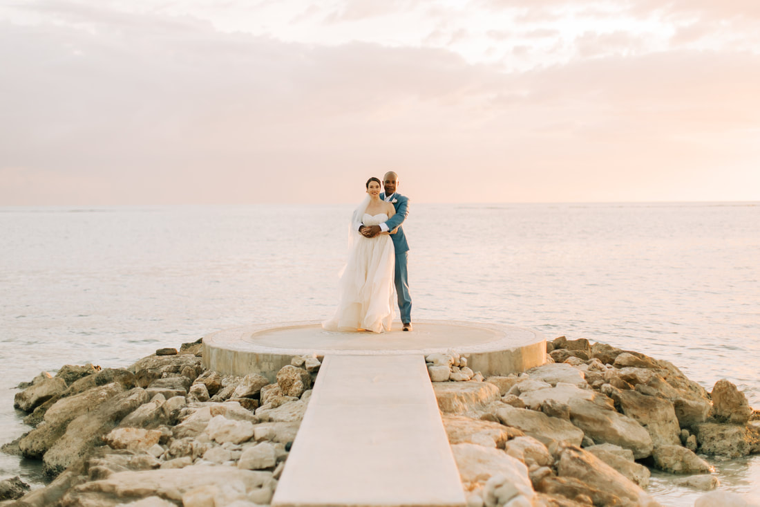 Bride and groom take wedding pictures at Sandals South Coast in Jamaica